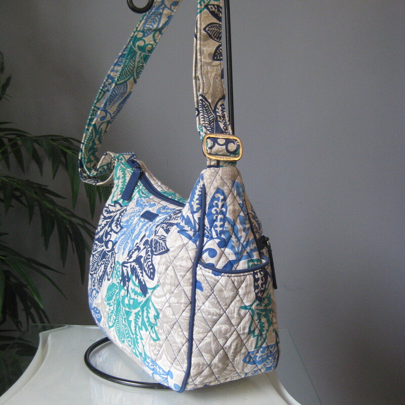 Vera Bradley Matching Wal, Blu/gren, Size: None<br />
This roomy crossbody bag by Vera Bradley is from 2017, in the Santiago pattern.<br />
Very long adjusttale shoulder strap.<br />
Outside zippered pockets and two side slip pockets.<br />
Inside there are slip pockets and one zippered pocket.<br />
11.5 x 8.5 x 4.25 (at the bottom)<br />
Strap adjusts from a 14.5 drop to a maximum 30 drop<br />
<br />
The matching wallet is included.  it has a turn lock closure and a zip around compartment.  The is space for cards, bills, receipts, ID.  It also has an outside zippered pockets.  8 x 5<br />
<br />
Both in great pre-owned condition.<br />
<br />
thanks for looking!<br />
#4212