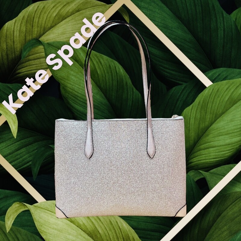 KATE SPADE<br />
NWT Kate Spade Large Glitter Fabric Tote in Rose Gold<br />
100% Authentic Kate Spade!<br />
MSRP: $249.00<br />
Style: K4626<br />
Features:<br />
-Material: Glitter Fabric with leather trim and bottom<br />
-Top Zip Closure<br />
-1 interior zip pocket<br />
-2 interior slide pockets<br />
-Approx dimensions: 14\" L x 11.25\" H x 5\" D<br />
-Handle drop 10\"<br />
This tote is new with the tags and has no marks or flaws.<br />
Makes an incredible gift.