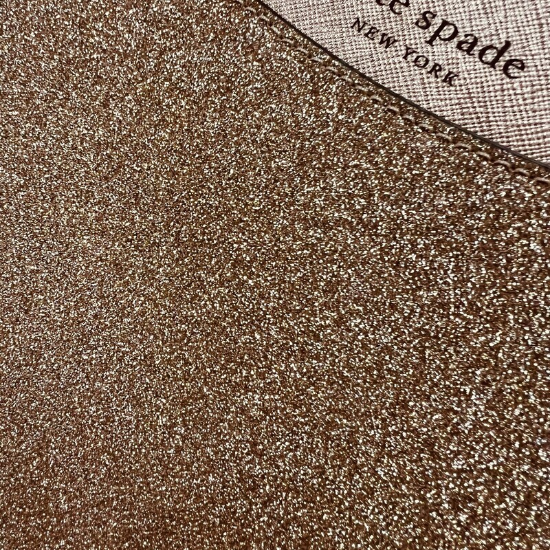 KATE SPADE<br />
NWT Kate Spade Large Glitter Fabric Tote in Rose Gold<br />
100% Authentic Kate Spade!<br />
MSRP: $249.00<br />
Style: K4626<br />
Features:<br />
-Material: Glitter Fabric with leather trim and bottom<br />
-Top Zip Closure<br />
-1 interior zip pocket<br />
-2 interior slide pockets<br />
-Approx dimensions: 14\" L x 11.25\" H x 5\" D<br />
-Handle drop 10\"<br />
This tote is new with the tags and has no marks or flaws.<br />
Makes an incredible gift.