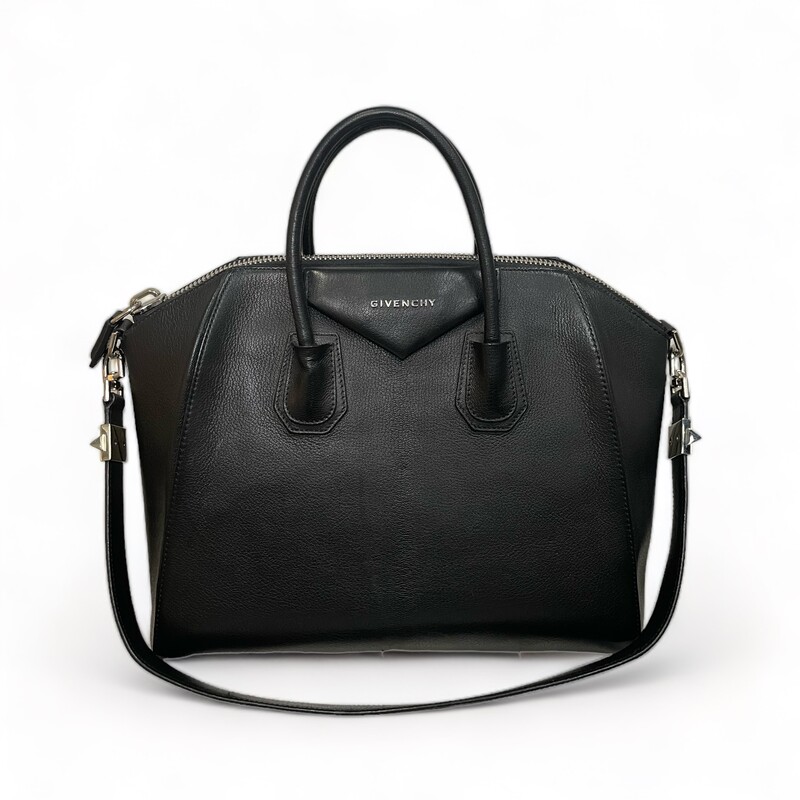 Givenchy Antigona Black Handbag<br />
Code:3C1102<br />
Size: Medium<br />
<br />
100% calfskin leather. Lining : 100% cotton. Metal pieces: 100% zamac.<br />
<br />
Dimensions:<br />
13.19 in x 11.02 in x 6.5 in<br />
Strap length: 30 in. Handle: 3.1 in.<br />
<br />
Medium handbag or shoulder bag in Box calfskin leather.<br />
Antigona line.<br />
Zipper closure with GIVENCHY 4G zipper pull.<br />
Pentagonal patch with silvery debossed GIVENCHY signature.<br />
Leather handles.<br />
Adjustable and removable strap in leather.<br />
Silvery-finish metal details.<br />
One main compartment with two flat pockets and one zippered pocket inside.