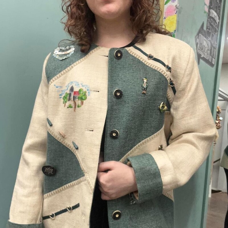 this blazer!!! You all!!  The pictures alone, you must see this in person!!!
from the 1980s
handpainted with pins on this blazer

features a handpainted castle/landscape
a viel gluck pin & a plethora of others
heart & ribbon accents
stiff boxy fit
labeled a size 40
shown on a medium model
tag is in german