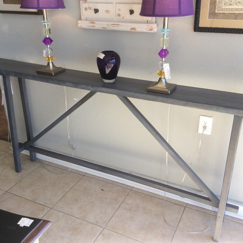 The table is versatile, may be used as a sofa, entryway, and or console table.  Painted dark grey wood material.  Measures:  84x9x35