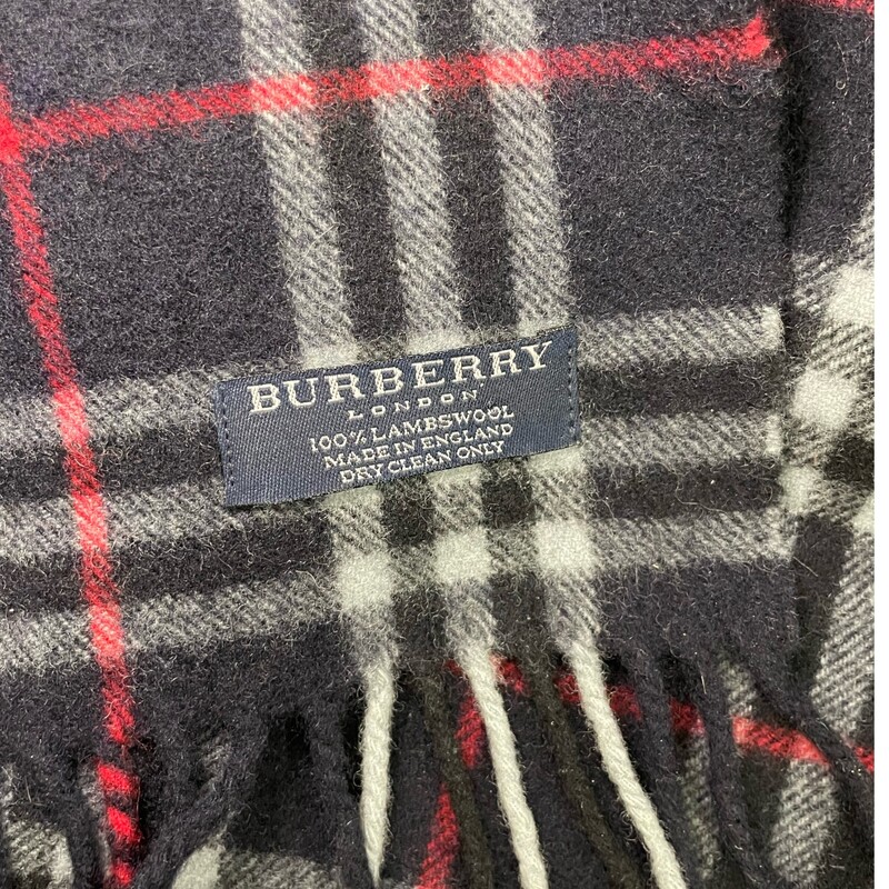 BURBERRY Wool Nova Check Fringe Scarf in Blue. This exceptional scarf is 100% lambswool in a nova checkered print in dark blue with a fringe trim.<br />
<br />
Length: 80.00 in<br />
Height: 12.00 in