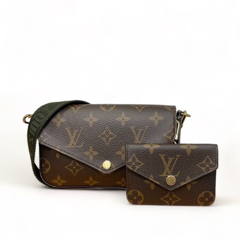 Louis Vuitton Felicie Strap & Go

Dimensions:
17 x 9.6 x 3.5 cm
Strap: Removable, adjustable
Strap Drop: 36.0 cm
Strap Drop Max.: 55.0 cm

Note: The corners of the flap and the edges of the handbag have wear. See photos.

This is an authentic LOUIS VUITTON Monogram Felicie Strap & Go in Kaki. This chic crossbody bag is crafted of monogram-coated canvas. The bag features a removable khaki canvas strap, a coin pouch and gold hardware. The front flap opens to a green fabric interior with card slots and a patch pocket.

Khaki Green
Monogram coated canvas
Jacquard textile strap
Microfiber and cowhide-leather lining
Gold-color hardware
Press-stud closure
Removable card holder
Inside flat pocket
3 card slots