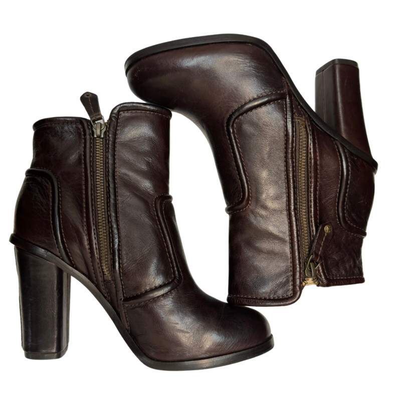 Frye Leather Sylvia Piping Boots<br />
Soft, vintage leather upper<br />
Leather-wrapped heel with center back seam<br />
Double zip openings on inside and outside of boot<br />
Breathable leather lining<br />
Leather outsole with rubber forefoot pad for non-slip performance<br />
Color: Rustic Brown<br />
Size: 7