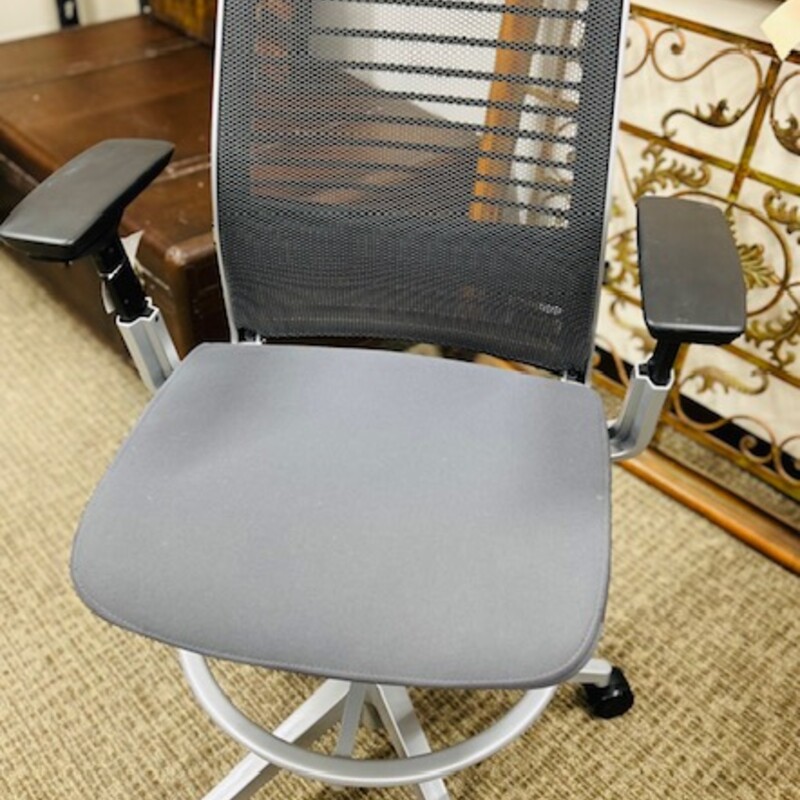 Steelcase Adjustable Think Drafting Stool Desk Chair<br />
Silver Gray Black<br />
Retails: $1500+<br />
Overall Size: 25 x 18 x 53H<br />
Just seat: 19 x 17D<br />
Floor to seat entire height: 33H<br />
Floor to seat lowest point: 24H<br />
<br />
LiveBack System boasts 15 uniquely-shaped linked flexors that automatically adjust to your body<br />
Cored seat foam pockets use adaptive bolstering technology to fit to you<br />
Tension-adjustable, weight-activated mechanism includes a synchro-tilt function<br />
Flexible front seat edge minimizes leg pressure and encourages better circulation<br />
Built-in dual-energy lumbar support<br />
Dynamic armrests<br />
Foot ring is height-adjustable