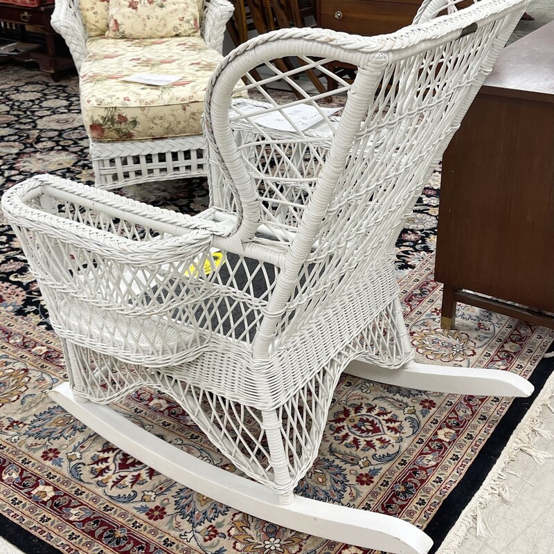 Vintage Henry Link rocking chair with magazine holder on side of arm, in a classic design.  From the Smithsonian Collection.  There is one cushion available, but it is only in fair condition.