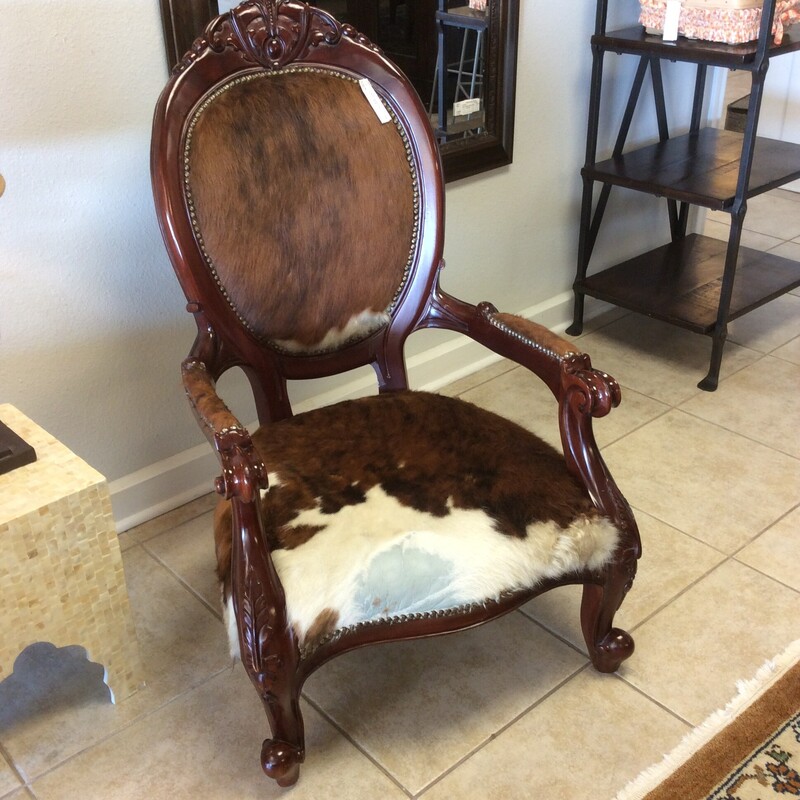 This slipper chair is so cool! Traditional in design, it will remind you of a simpler time.  But this beautifully blends the past to the present.  Upholstered in cowhide with a big, bold nailhead trim. We have  2 of them priced separately.