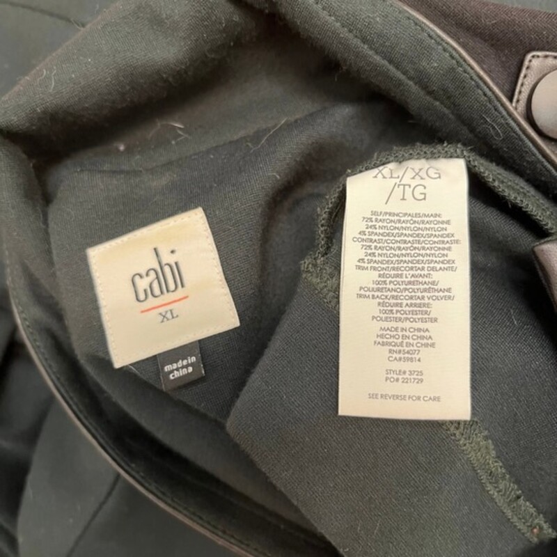 CAbi Renaissance Jacket<br />
Asymmetric zip front, Snap, Collared, Zip sleeve, Pockets, Breathable, Lightweight, Mid Length<br />
Color: Forest, with Black Faux Leather Trim<br />
Material: 72% Rayon, 24% Nylon, 4% Spandex<br />
Size: XLarge
