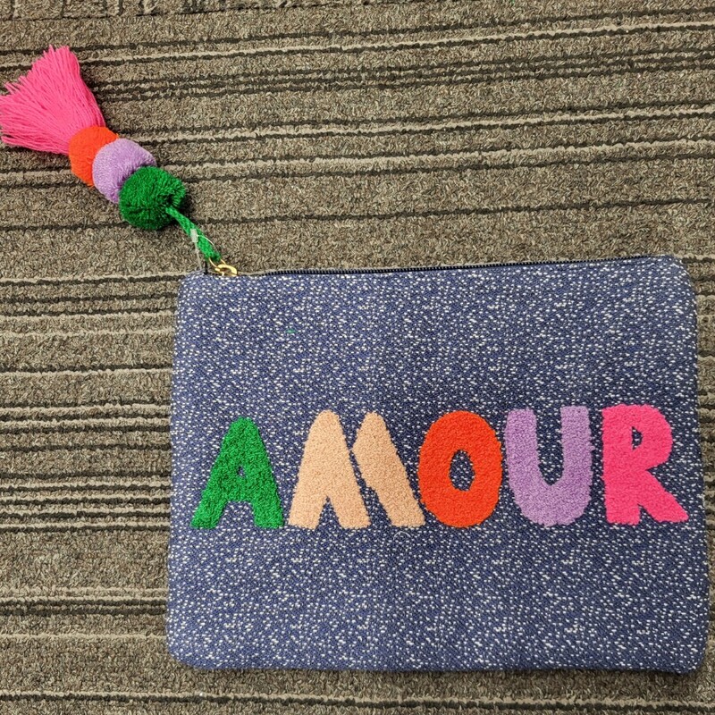Perfect Brand New condition!
Denim chambray pouch with novelty pom tassel pull.
Playful terry-towel AMOUR letters
Dimensions: 11.125  L x 8.25 H
Material: Navy Chambray
Wool embroidery and pom tassel.
Lining: You are loved Stripe in Pink Multi
Hardware Materials: gold
Interior details: Drop pocket Stella & Dot Amour Pouch/Clutch never used, without tags.  Super cute for a fun night out!
Dimensions: 11x8.5 Zipper closure.Pompom with fringe dangling from the zipper.