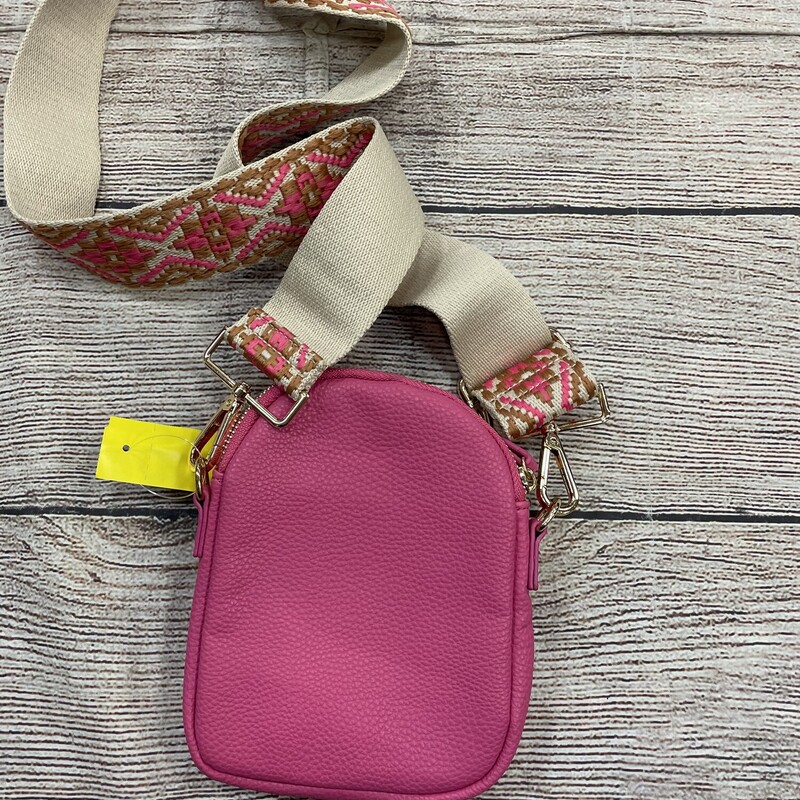 Fushia cross body purse has a wide adjustable strip with cool embroidery 2 zip pockets