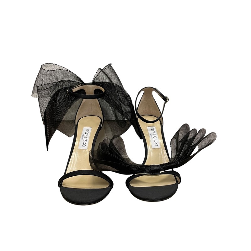 Black Jimmy Choo Bow  Heels<br />
<br />
Jimmy Choo Aveline fabric sandals with tulle bow accent<br />
4.00 in / 100 mm stiletto heel<br />
Open toe<br />
Adjustable ankle strap<br />
Leather outsole<br />
Made in Italy