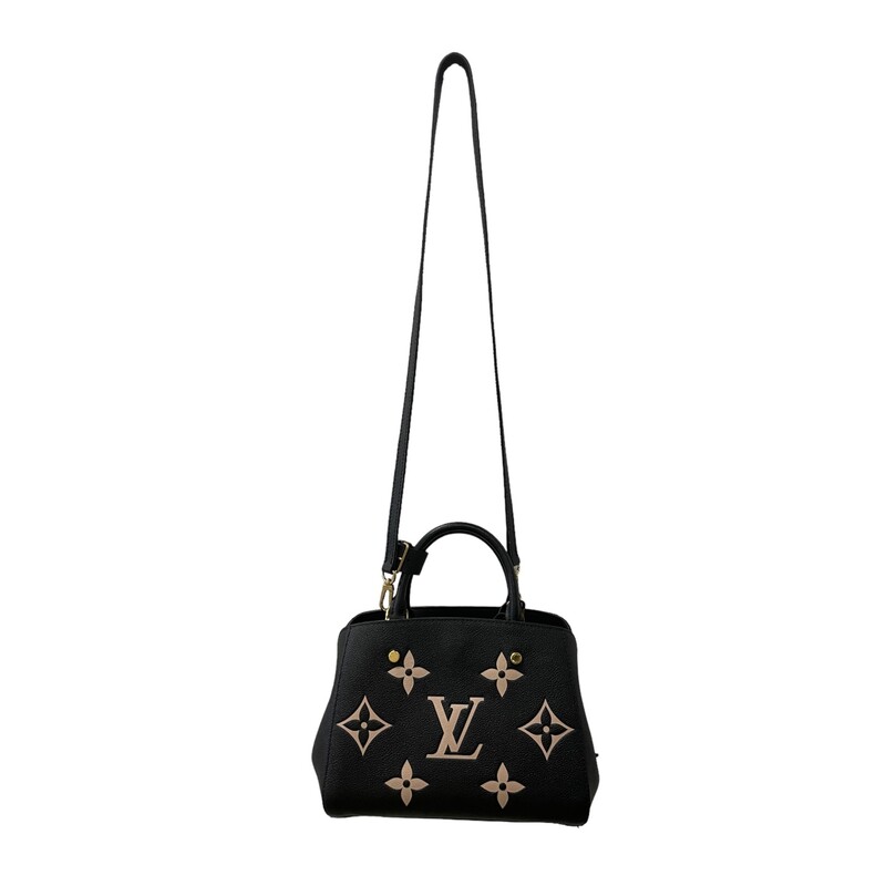 LOUIS VUITTON Empreinte Monogram Giant Montaigne BB in Black and Beige. This popular crossbody handbag is featured in rich calfskin, embossed with a giant Louis Vuitton monogram in beige on black leather. The shoulder bag features a leather top handle, and an optional adjustable leather shoulder strap. This opens to a partitioned microfiber interior with patch pockets.<br />
<br />
Size<br />
<br />
Base length: 9.5 in<br />
<br />
Height: 7.75 in<br />
<br />
Width: 4 in<br />
<br />
Drop: 3.5 in<br />
<br />
Drop: 22 in