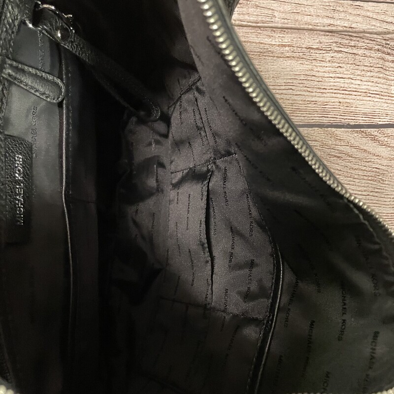 M Kors shoulder purse black has tassel also has a cloth bag