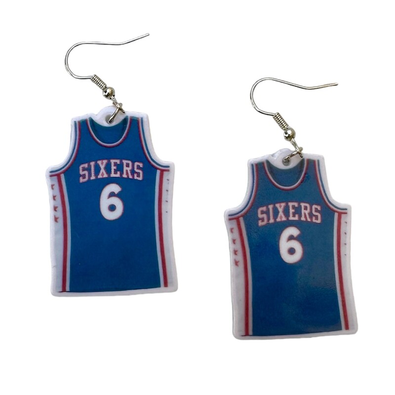 Sixers Jersey

BEFORE BUYING, PLEASE READ THIS ENTIRELY:

Earrings are made from plastic material (very light and comfortable) and with hypoallergenic wires. We have both gold and silver but will default to silver when shipping out to you. If you want gold, PLEASE EMAIL US AND LET US KNOW IN ADVANCE. :)

Earrings measure approximately 1.5 inches (some slightly bigger, some slightly smaller, depending on the design) not including the wires. Please allow +/- 0.5cm variances (pairs will always be the same size). Colors may look slightly different due to your monitor or phone screen.

There are multiple quantities available of each style, please specify if you want more than one of each pair.

Click on the ACCESSORIES link to see all other items.

For earrings only: shipping is $6 regardless if you buy 1 pair or 20 pairs. We have over two dozen styles, grab extras as gifts for coworkers, friends, and family! ***Automatic shipping calculations are set and we cannot change it for just the earrings, so you’ll receive a refund for the difference in shipping charges.

PLEASE ALLOW AT LEAST 1 WEEK FOR SHIPPING. THANK YOU FOR SHOPPING SMALL, WE APPRECIATE IT!