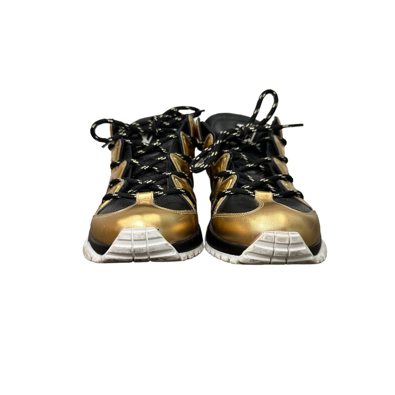 Louis Vuitton ZigZag Sneakers
Size: 7.5Mens 9.5 Womens

This is an authentic pair of Louis Vuitton Calfskin Zig Zag Sneaker  in Black and Gold. These stylish sneakers are crafted of black calfskin, with gold leather trim.