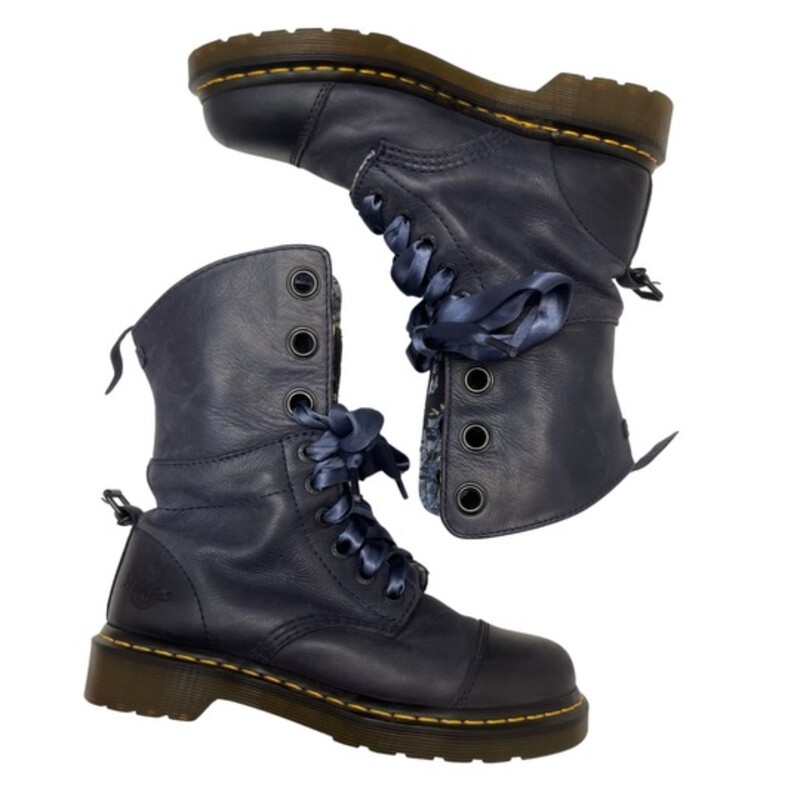 Dr Martens Aimilie Leather Combat Boot

Foldover Lace Up 9-eyelet boot
(similar to triumph with shorter shaft)
Can be worn up or folded down to ankle height
Navy Leather with floral canvas lining
Satin ribbon laces
Size: 38   7 -7.5