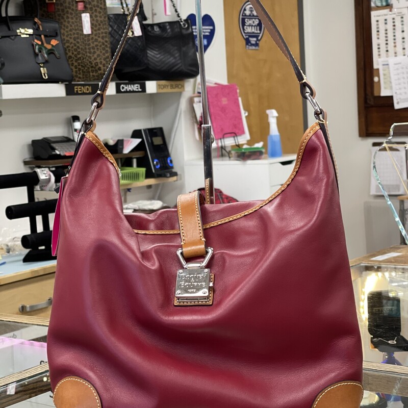 Dooney&Bourke Shoulder bag in deep rich boold red with red interior and chestnut handles and silver hardware