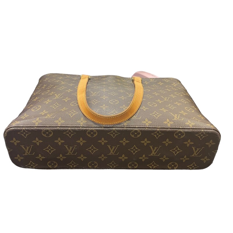 Louis Vuitton Loco Tote<br />
Monogram toile canvas. The bag features tall vachetta leather strap handles with brass links. The top zipper opens to a spacious beige microfiber interior with zipper and patch pockets.<br />
Dimensions: W:15.9 x H:11.8 x D:4.1<br />
Drop: 10 in