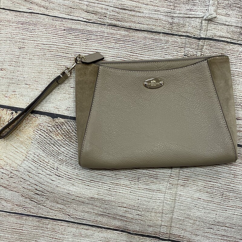 Coach leather  Wristlet, Khaki and  suede on the sides of , Pockets on the front  and also has  zipper compartment.