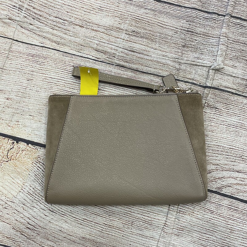 Coach leather  Wristlet, Khaki and  suede on the sides of , Pockets on the front  and also has  zipper compartment.