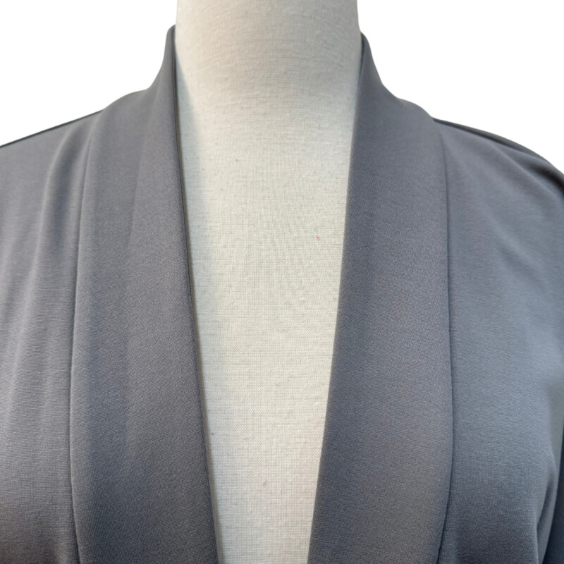 New Eileen Fisher Jacket<br />
High Collar with Belt<br />
Color: Smoke<br />
Size: Large<br />
Retails for $328.00