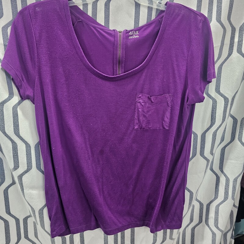Short sleeve knit top with a half zip up in the back. Small pocket on the front chest panel in a polyblend material. Super cute.