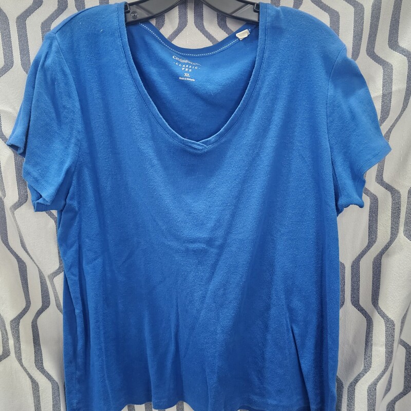 Short sleeve knit top in blue with a crew neck line.