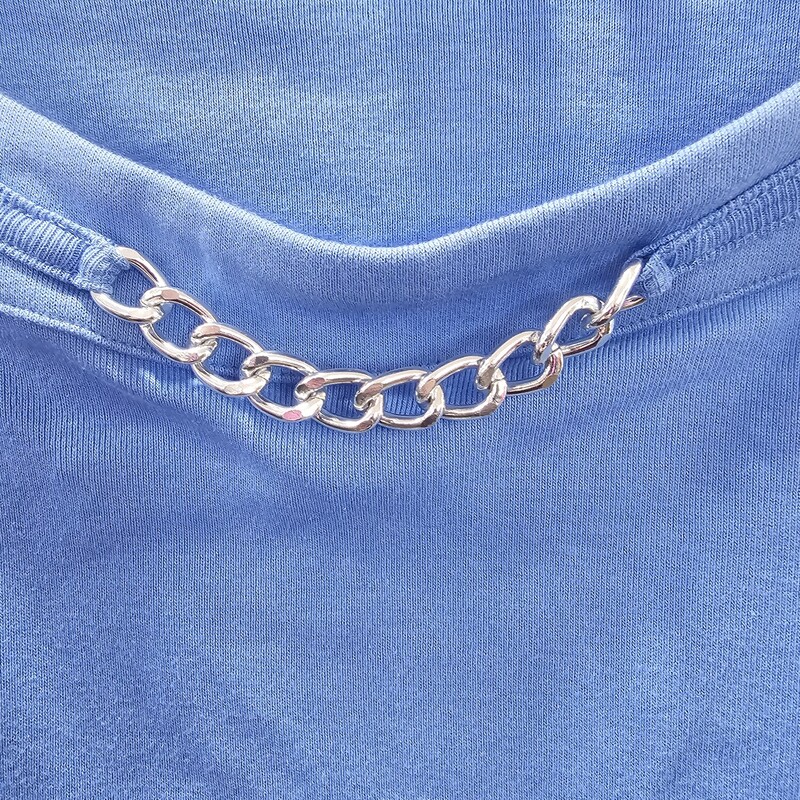 Cute short sleeve knit top in blue with a metallic embellishment in a sewn in chain on the neck line.