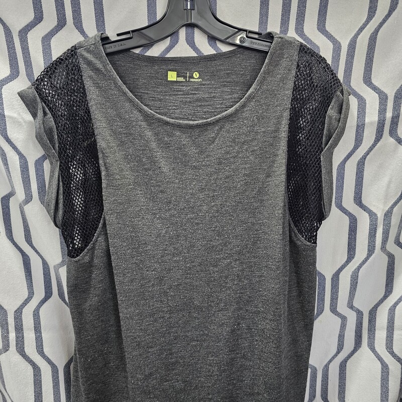 Grey cap sleeve tee with mesh cut outs in black on the sleeve and underarm area. Crew neck line.