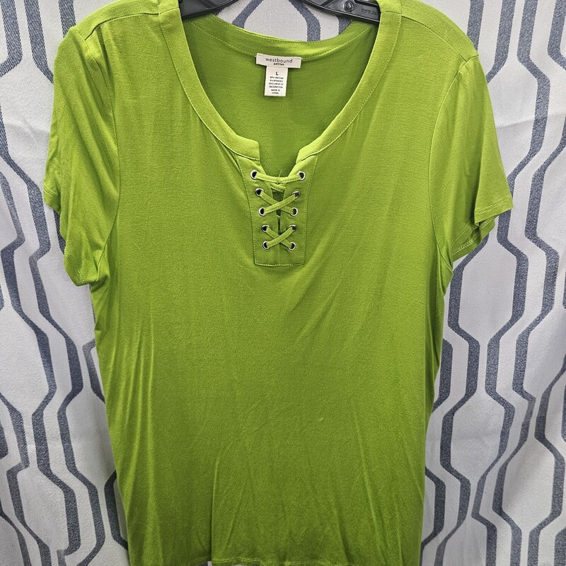 Perfect tee for year round wear in this great green coloring! Cute lattice at the neck with metallic gromets. It is a must have.