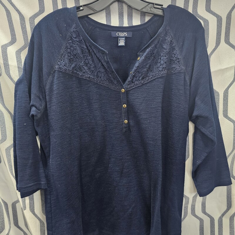 Half sleeve knit top in a navy blue. Half front button with a lace embroidered panel at the top. Super cute for those colder days.