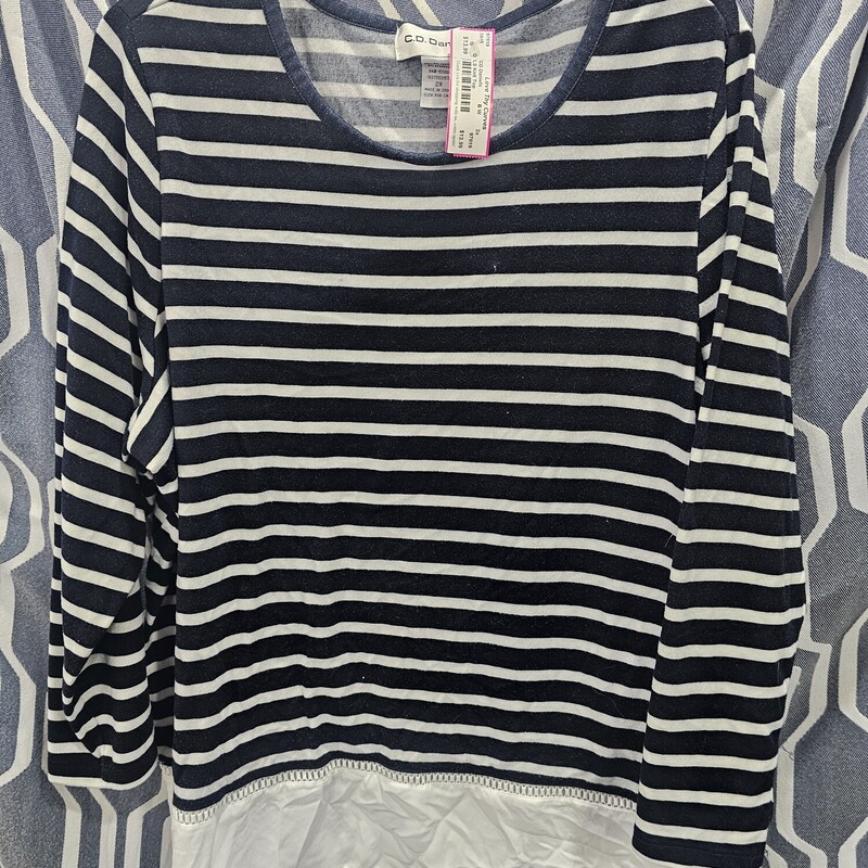 Long sleeve light weight knit top in navy and white with the layered look sewn in on the bottom hem. Crew neck line,.