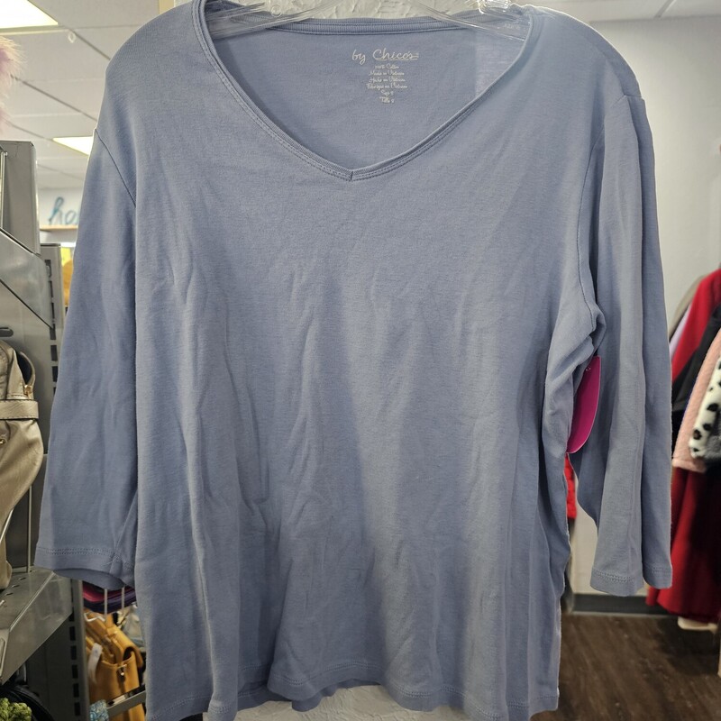 Half sleeve knit top in blue with crew style neck line.