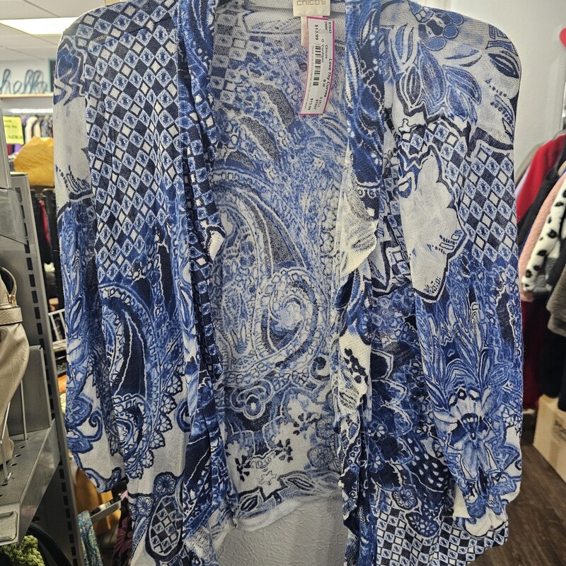 Cute open front cardigan style top. Ruffled front with blue, white and navy print. Super light weight.