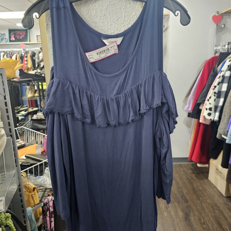 Super cute and super soft, this cold shoulder top has half sleeves and a cute ruffle for added flair. done in a dark blue, almost navy color.