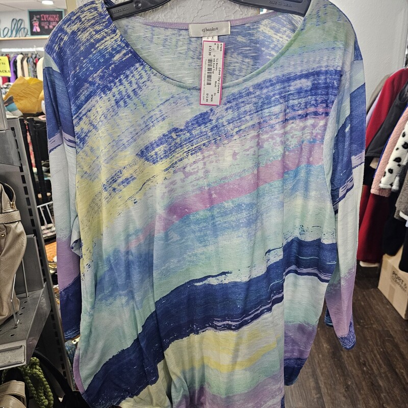 Half sleeve knit top in blues, purple, yellow and green design with crew cut neckline.