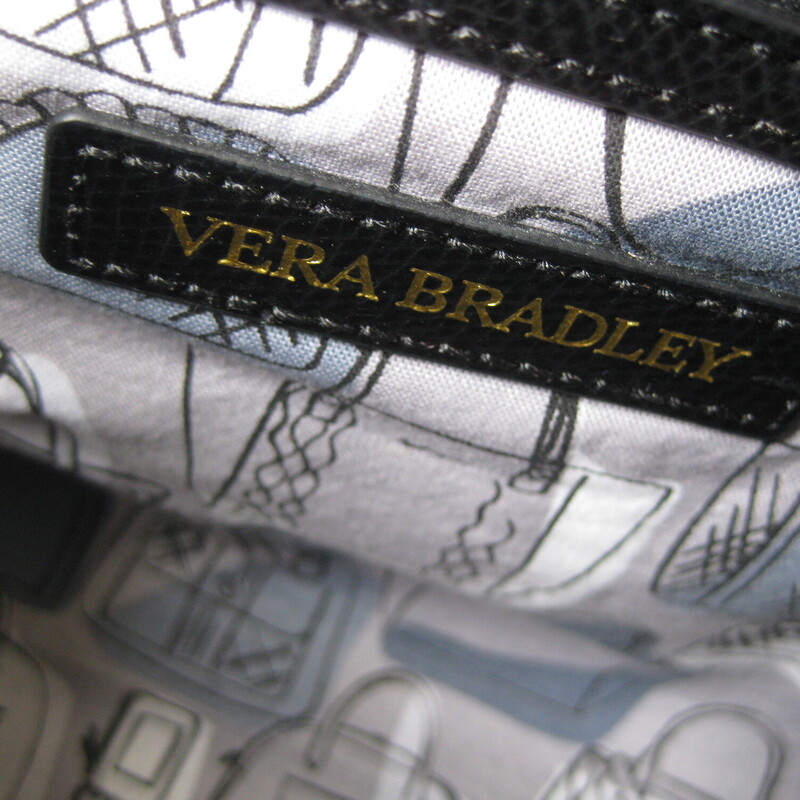 Vera Bradley Leather Tote, Black, Size: None<br />
Sophisticated, roomy and well designed<br />
Vera Bradley leather satchel.<br />
This bag has and room and organization option as well as security and good looks.<br />
It is lightly embossed with an oval leaf design, very smooth to the touch.<br />
Gold Hardware<br />
Double handles and adjustable and removable shoulder strap.<br />
Three main compartments plus interior pockets.<br />
The middle compartment zips closed and the two sides come together with strong hidden magnetic snaps.<br />
Gorgeous and in excellent pre-owned condition, like new, no flaws.<br />
And don't miss that adorable purse print lining.<br />
11 across at the top<br />
14 across at the bottom<br />
 8.5 tall and 6.5 deep.<br />
Handle drop: 5.5, strap drop 21.5 maximum, 17.25 minimum<br />
<br />
thanks for looking!<br />
#68661