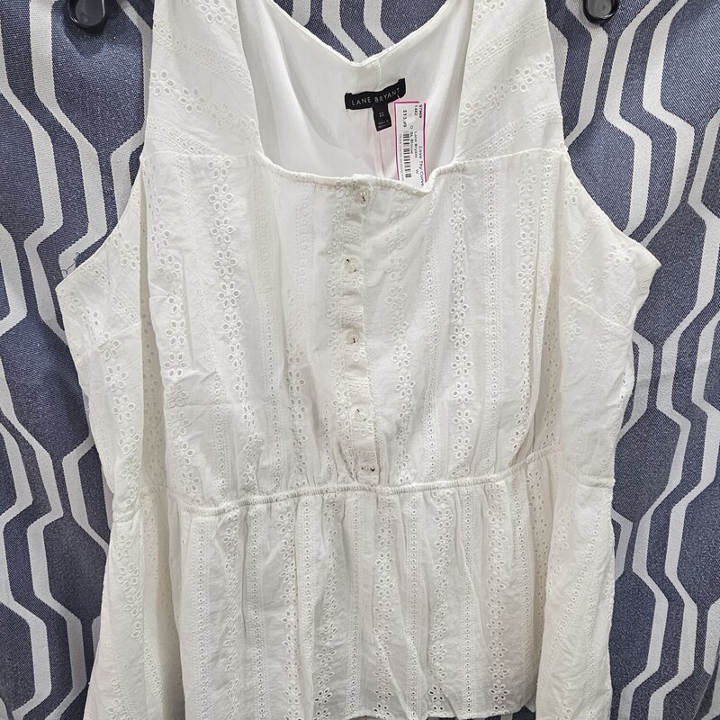 Super cute sleeveless white blouse with baby doll cut under the bust.