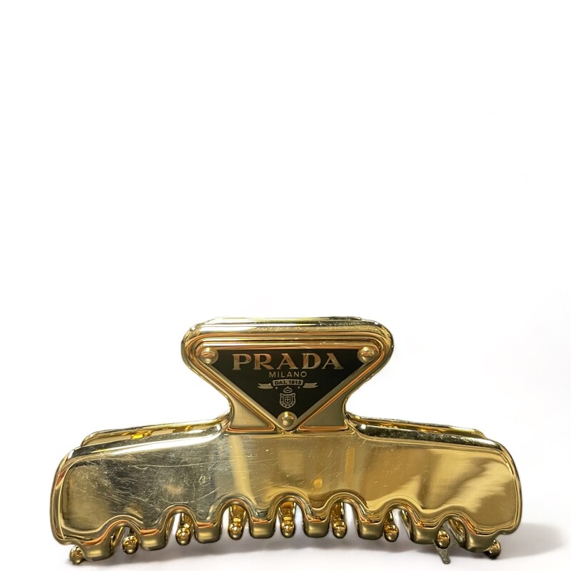 Prada Gold Hairclip

Dimensions:
10.0 (3.93'') W x 4.95 (1.94'') H

This hair clip with sophisticated and versatile allure is made of enameled metal and decorated with the triangle logo on one end.
Enameled metal triangle logo
Hypoallergenic and nickel-free materials