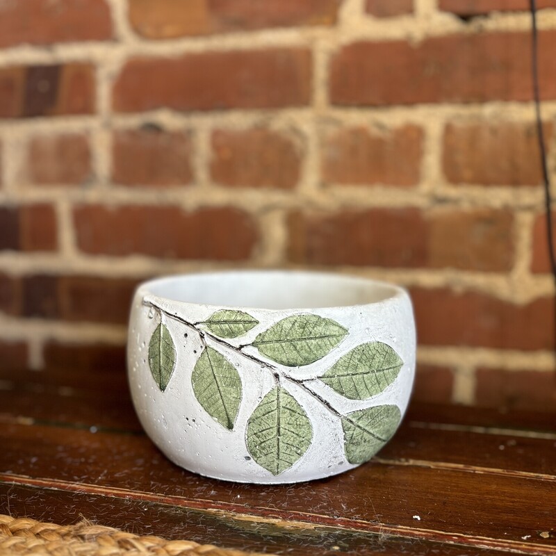 The cement planter with leaves is a pretty pot with raised painted leaves<br />
Pot measures 4 inches high, 6 and a half inches around and is 3 and a half inches deep