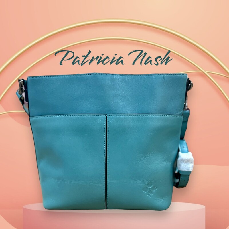 Patricia Nash
Harper Tote Crossbody
Gorgeous leather in the distinctive blue grass luxurious tone for this convenient tote that blends versatility with elegance. In addition to the adjustable/detachable shoulder strap, there is also a detachable handle to easily carry just what you need with this nicely sized, stylish bag.
100% full-grain leather
Interior: 1 zip pocket, 2 slip pockets; faux suede lining, 100% polyester
Exterior: 1 front slip pocket with magnetic snap closure, 1 rear slip pocket with magnetic snap closure, deep embossed grape leaf logo, protective metal feet, brushed silver finish
Magnetic snap closure
Signature brushed silver hardware, heavy handcrafted stitching
Dimensions: 12 1/2\"(W) x 10 1/4\"(H) x 5\"(D)
Strap drop: 21 1/2\" - 24 1/2\"
Handle drop: 10\"
Retails:  $249.00
This bag comes with the original dust cover and is like new condition.
