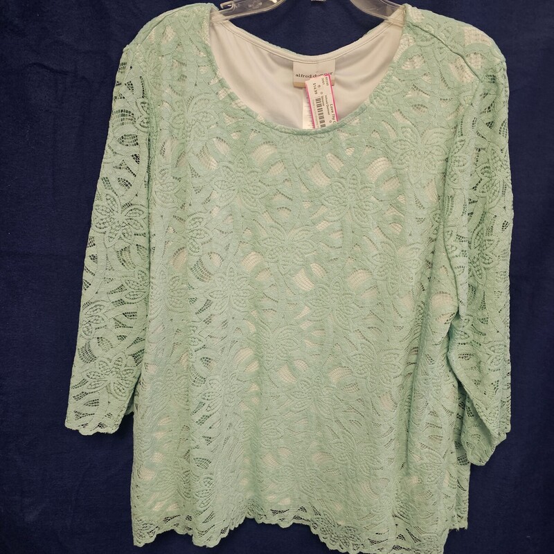 Beautiful dual layered blouse in mint green lace and a white under layer with sheer half sleeve arms