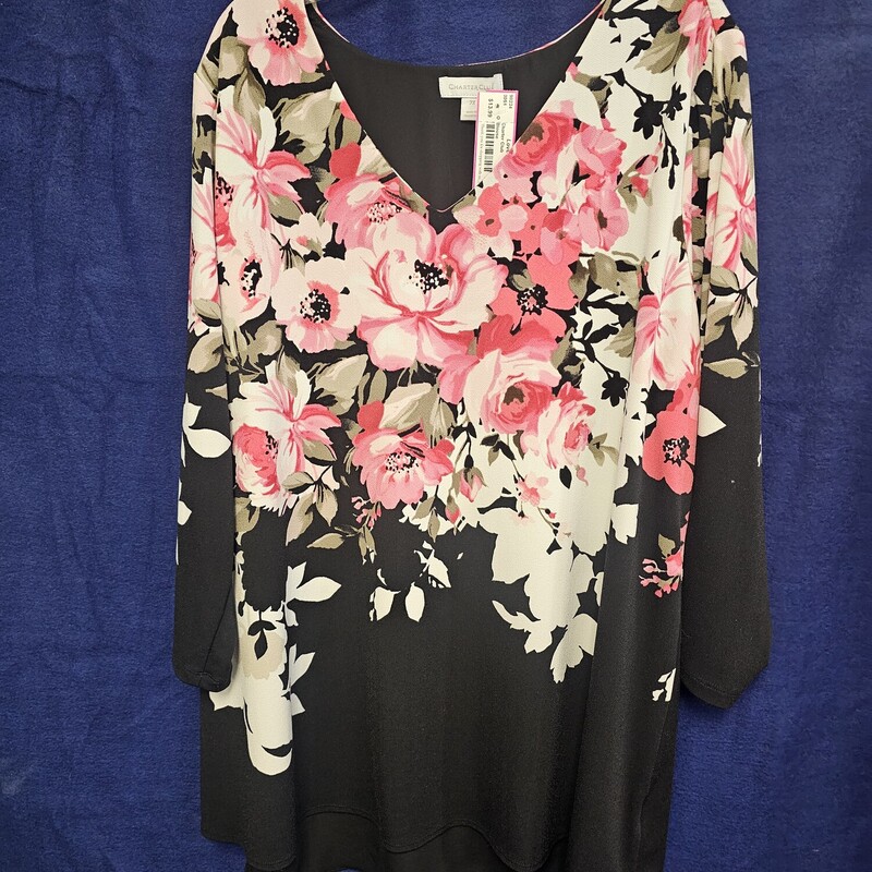 Beautiful black blouse with bold floral print. Half sleeve and open style back with a sheer black panel.