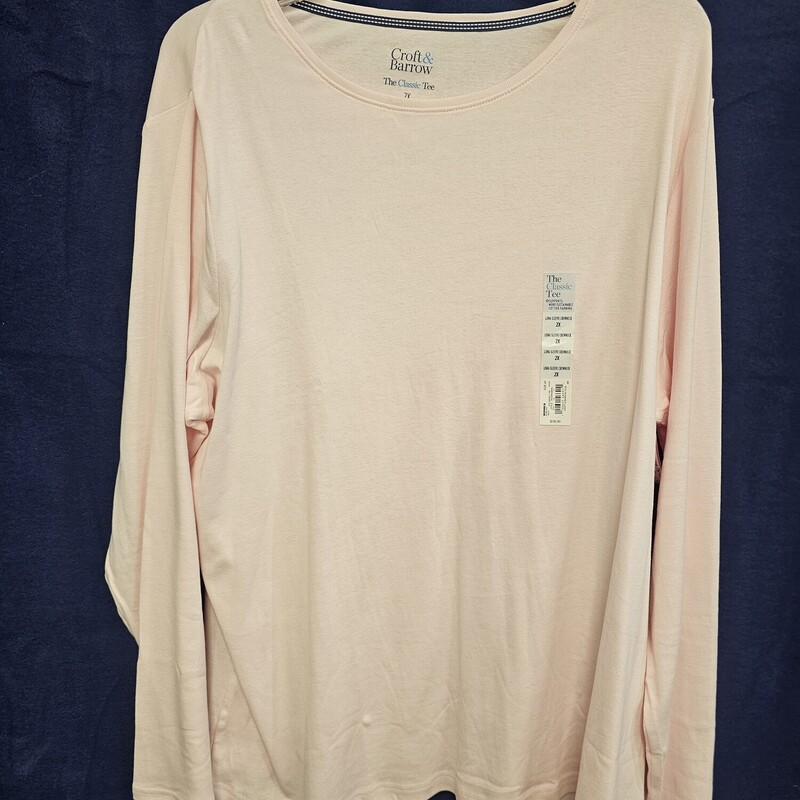 Brand new with tags, this long sleeve tee is done in a soft pink and retails for $18