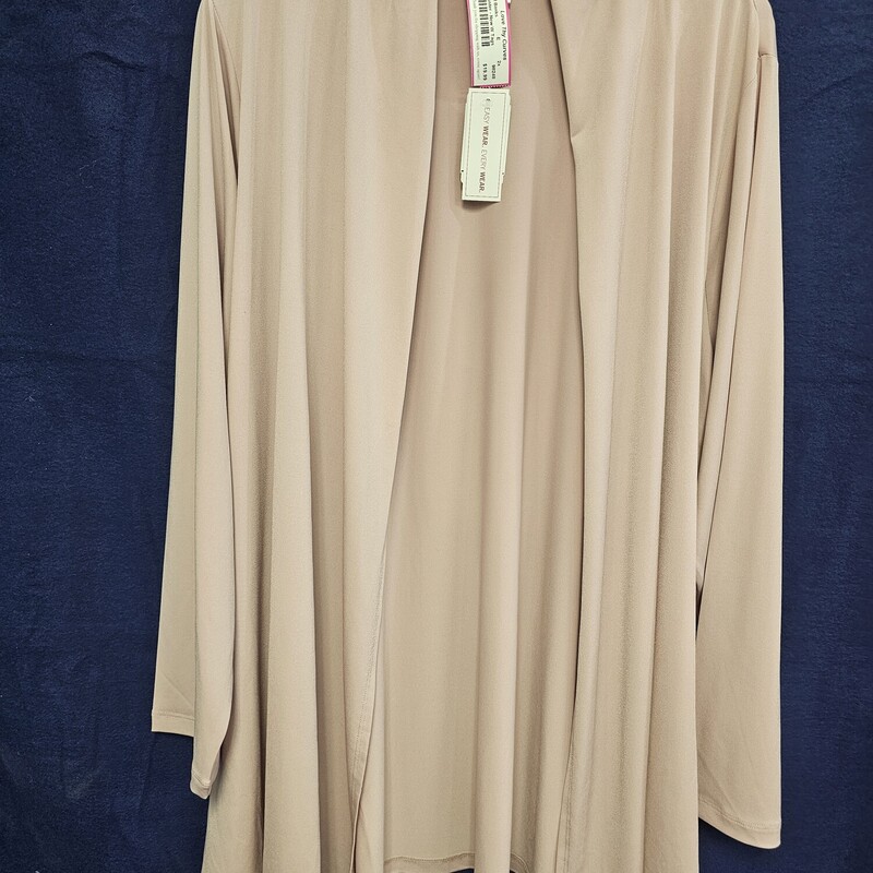 Classy and chic and brand new with tags, this duster retails for $60!  No close front and long sleeves, this lower hip length duster can be dressed up or down.