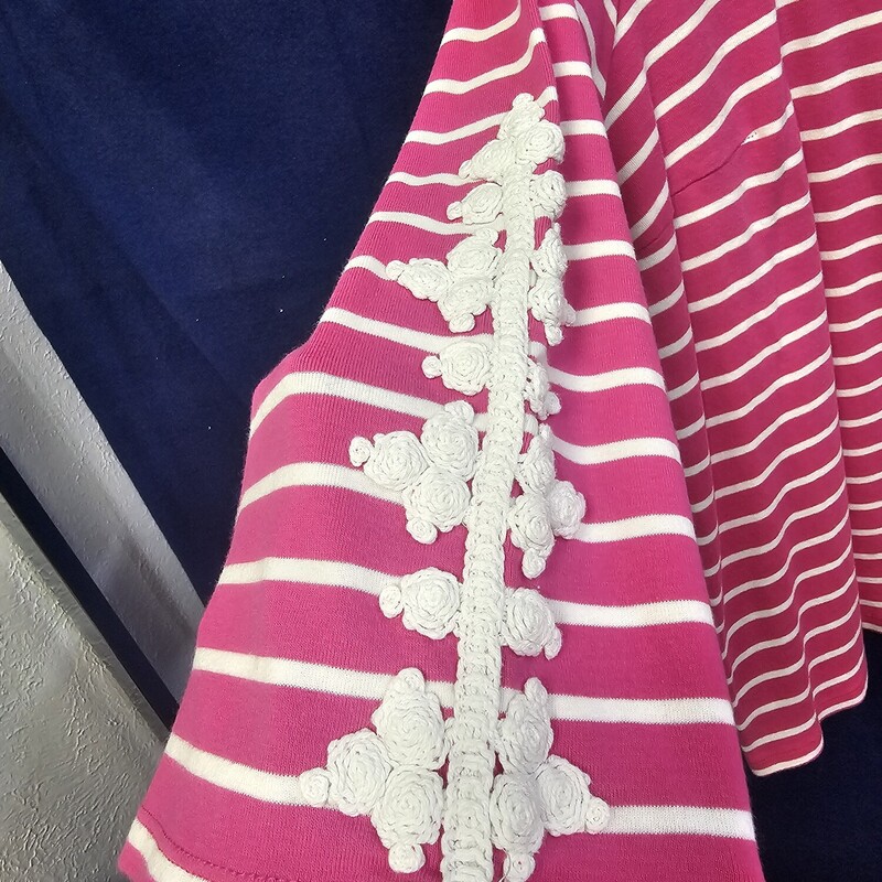 Half sleeve knit top in pink and white with cute embellished lace look on the sleeves.