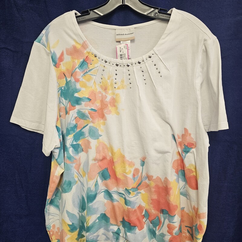 Short sleeve knit top in white with fun bold print and studding along the neckline.