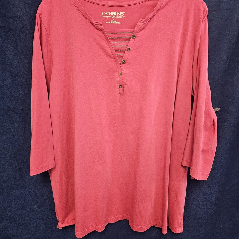 Super cute half sleeve knit top in pink with sewn in under shirt panel in a grey and pink stripe for added appeal.