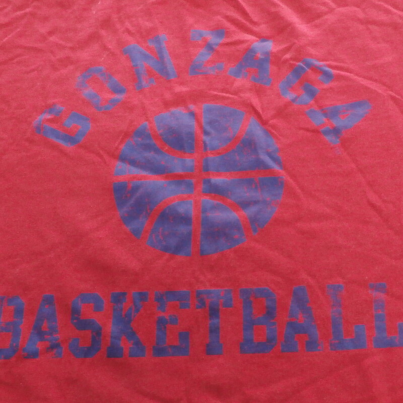 Gonzaga Bulldogs men's Champs Sports Short Sleeve Shirt Size Medium Red #14002<br />
<br />
Rating:   (see below) 5 - Poor Condition<br />
<br />
Team: Gonzaga Bulldogs<br />
<br />
Player: n/a<br />
<br />
Brand: Champs Sports<br />
<br />
Size: Medium - Men's(Measured Flat: Across chest 20\"; Length 27\")<br />
Measured Flat: arm pit to arm pit; top of shoulder to the bottom hem<br />
<br />
<br />
Color: Red<br />
<br />
Style: short sleeve shirt; screen pressed logo<br />
<br />
Material: 100 Cotton <br />
Condition: - Poor Condition - wrinkled; material faded and discolored; Stains on the front of the right shoulder; arm pit stitches are ripped; pilling and fuzz are present; material feels coarse; two holes on the bottom of the back; materiel is worn(See Photos for condition and description)<br />
<br />
Shipping: $3.92<br />
<br />
Item #: 14002